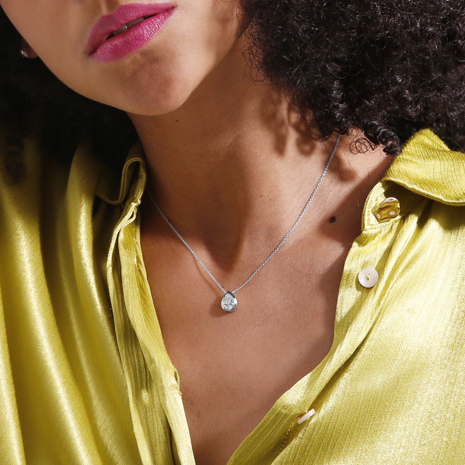 Elevate your style with our Dainty Bezel Pear Colorless (D-F) Pendant